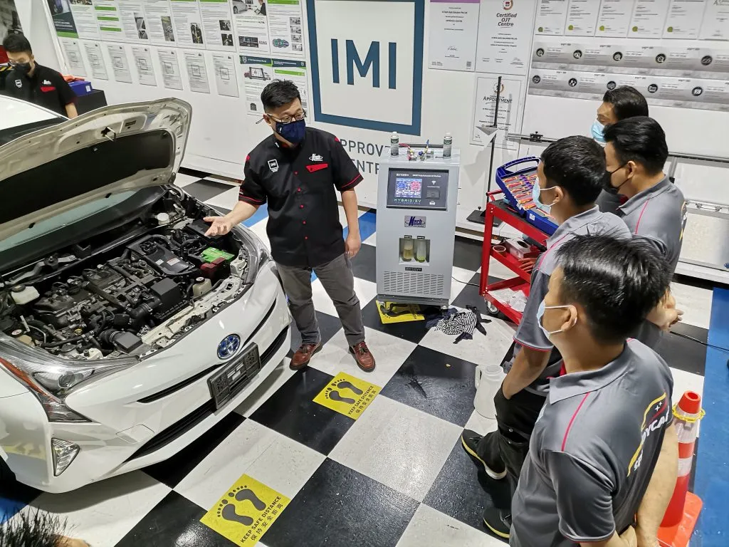 Automotive technical training session with diagnostic equipment at K-Tech Singapore